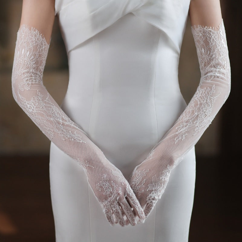 Elegant white lace bridal gloves for weddings1